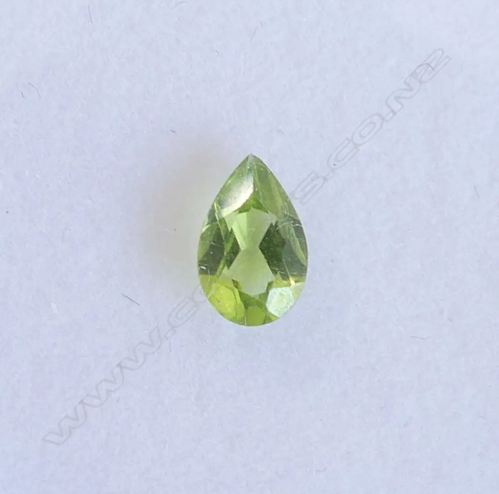 2 GEMS, 1 PEAR CUT PERIDOT & 1 BLUE ZIRCON BOTH WITH AIG CERTS Image 1++