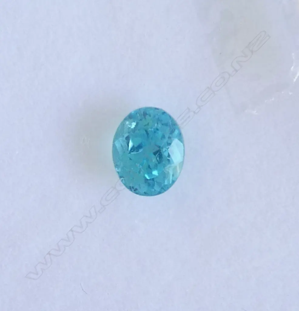 2 GEMS, 1 PEAR CUT PERIDOT & 1 BLUE ZIRCON BOTH WITH AIG CERTS Image 1++