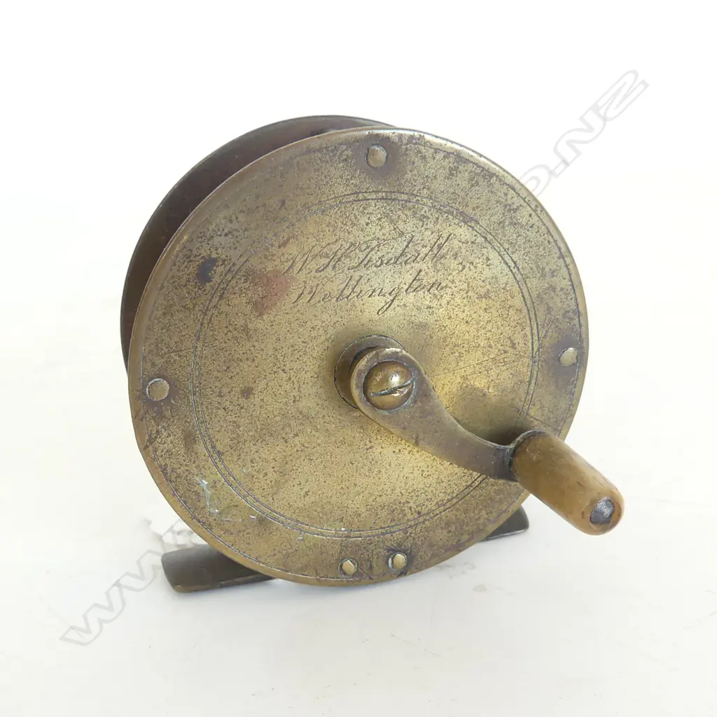 A Pye: 2 3/4"x 1 1/4"brass REEL with serpentine arm & horn handle engraved W.H. Tisdalls Wellington. c1895 Image 1++