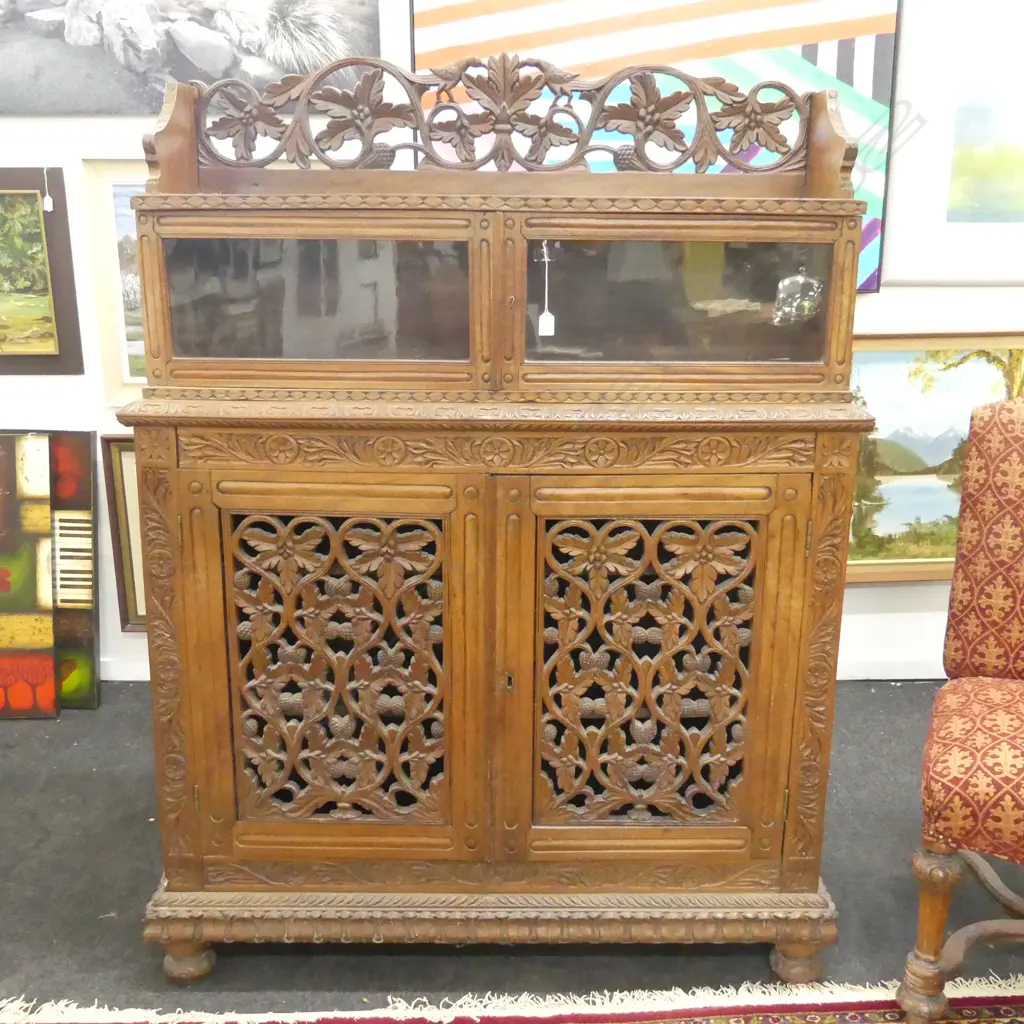 ORNATELY CARVED CUPBOARD WITH GLAZED UPPER SECTION IN TWO PIECES H 1590 W 1200 Image 1++