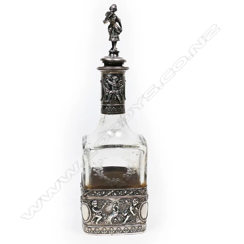 A Continental silver cased glass decanter Image 1++