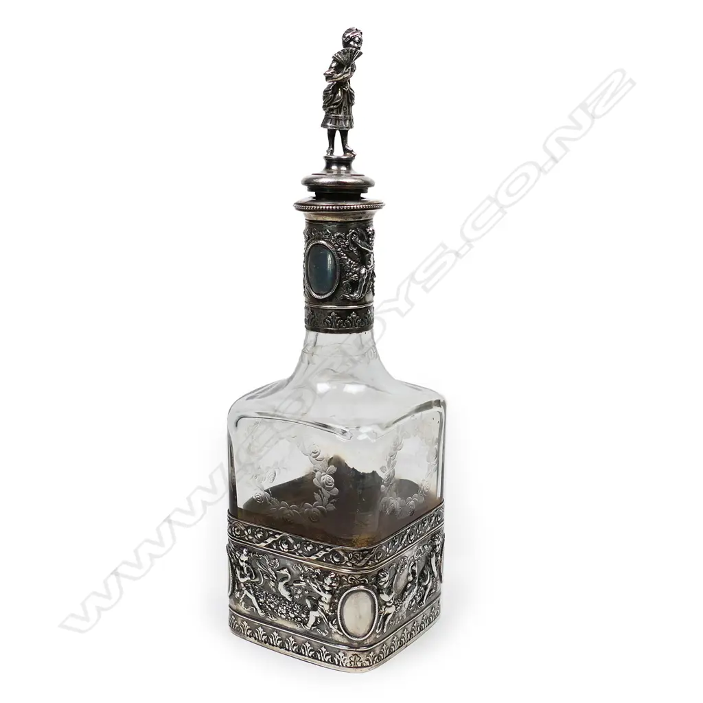 A Continental silver cased glass decanter Image 1++