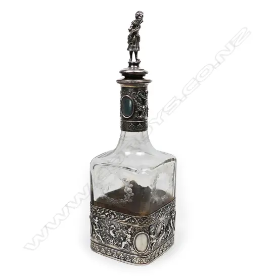 A Continental silver cased glass decanter