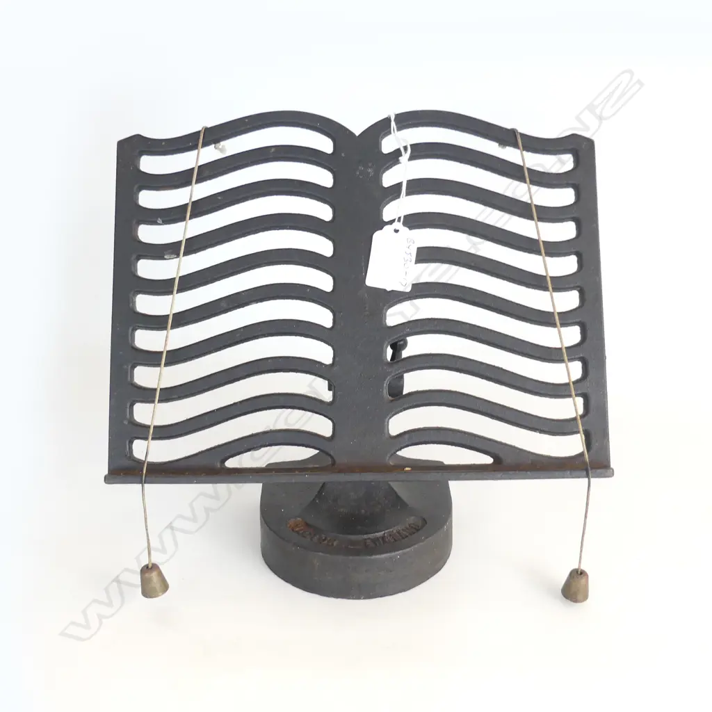 OLD CAST IRON BOOKREST Image 1++