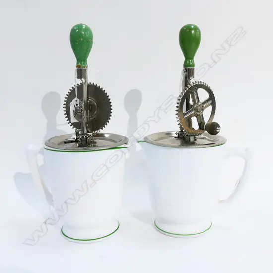 (3527/2665) 2 VINTAGE HAND HELD ROTARY BEATERS ON MILK GLASS MEASURES H.320mm