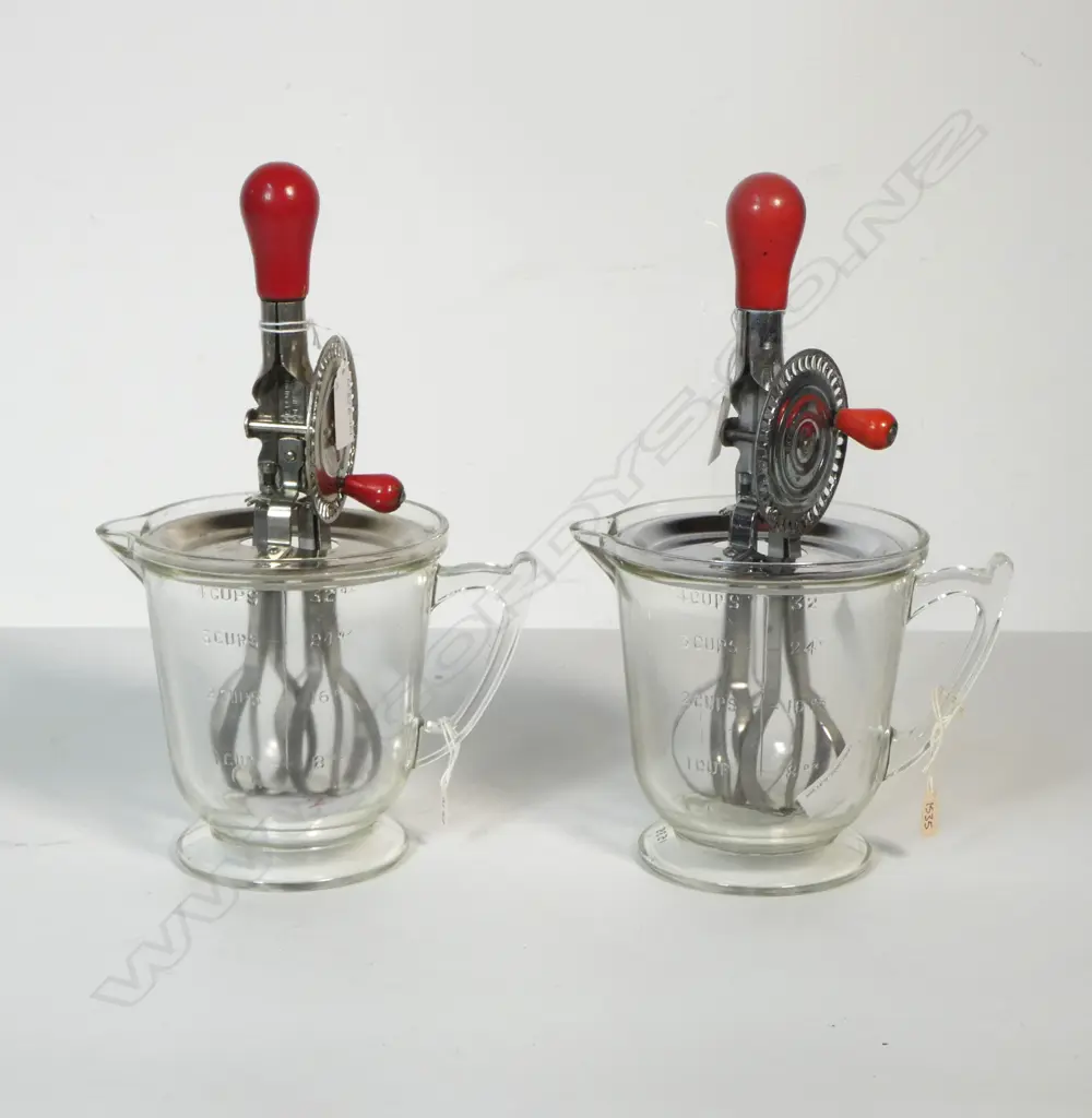 (1535/2152) 2 VINTAGE HAND HELD MERRY WHIRLS ON CLEAR GLASS 'HANDMAID' MEASURE JUGS  Image 1++