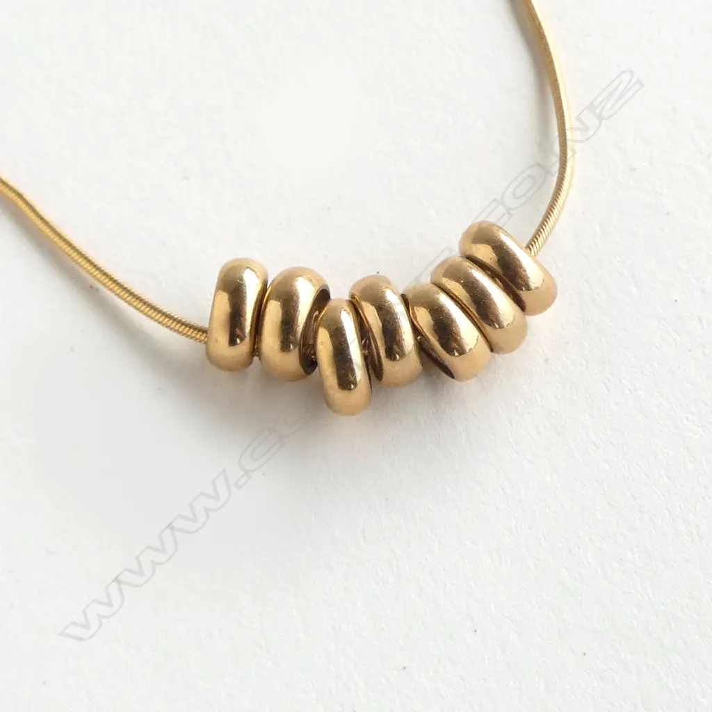 9CT GOLD FINE CHAIN WITH SEVEN RINGS NECKLACE 7gm Image 1++