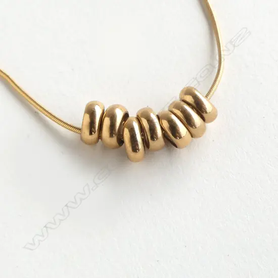 9CT GOLD FINE CHAIN WITH SEVEN RINGS NECKLACE 7gm