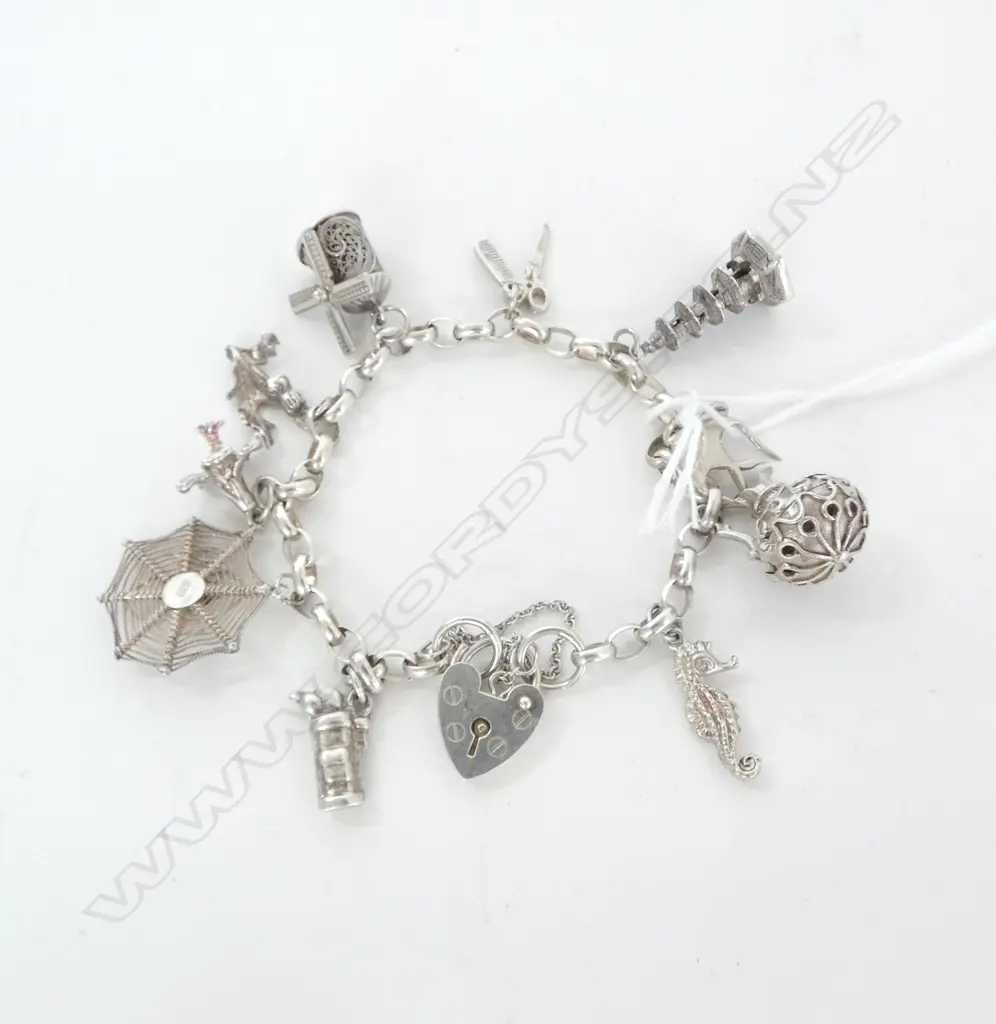 SILVER CHARM BRACELET, 10 SILVER CHARMS, 26.2gm Image 1++