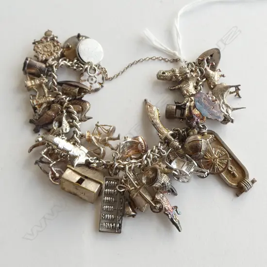 SILVER HEAVILY LOADED CHARM BRACELET approx 40 charms 78gms