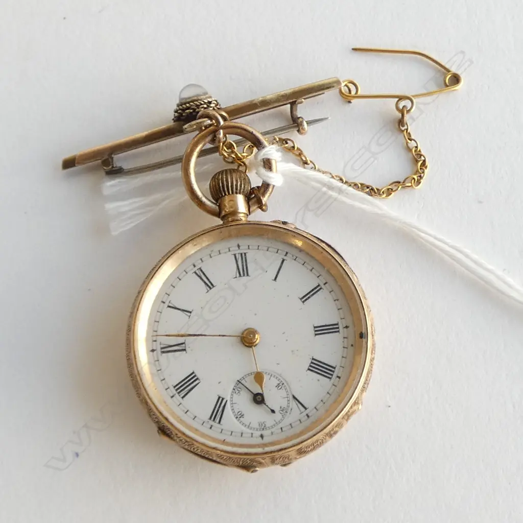 14ct GOLD LADIES open face POCKET WATCH engraved case.on gold bar. 28.9gms Image 1++
