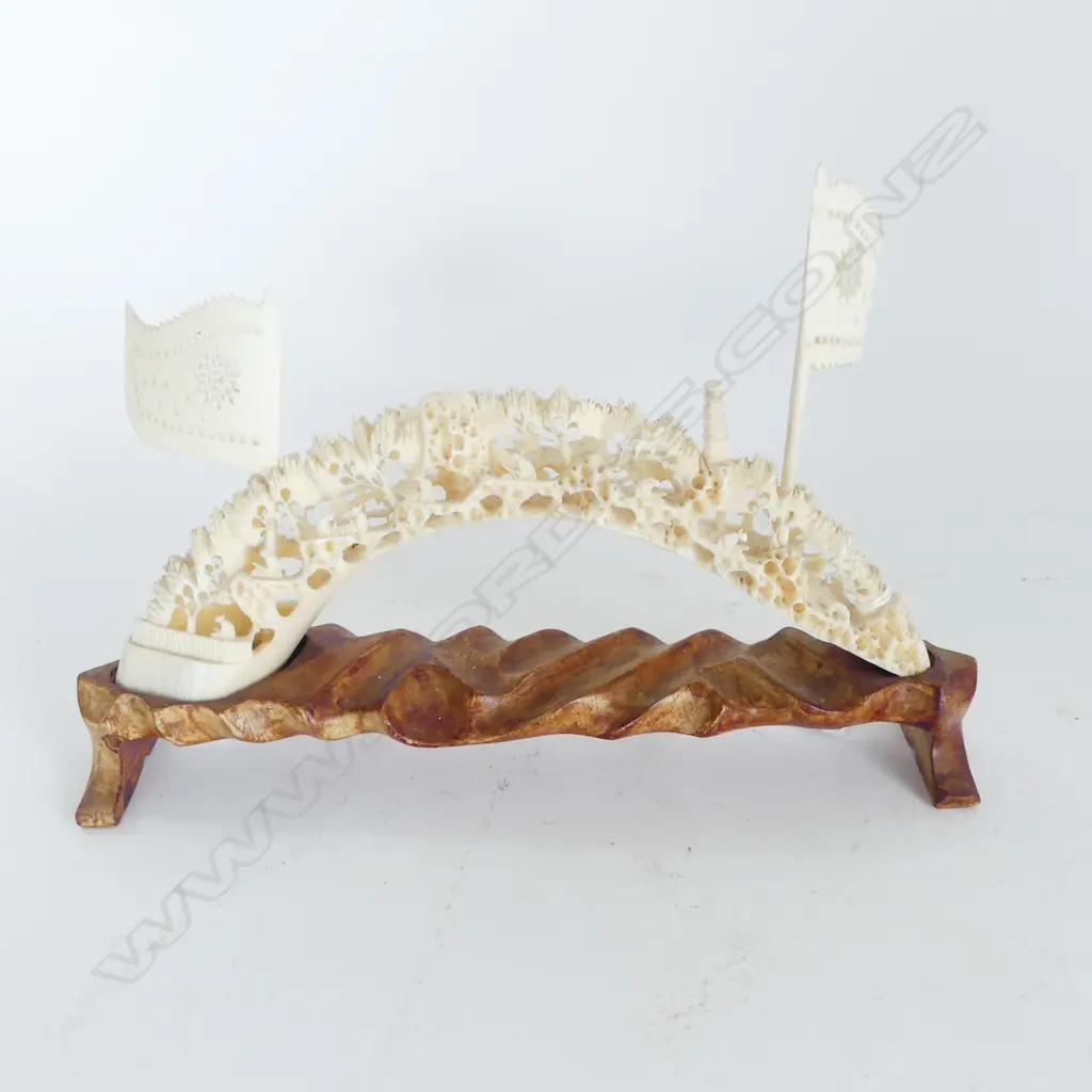 CHINESE FINELY CARVED MARINE IVORY (HIPPO TUSK) TUSK BRIDGE with flags on carved wood stand. L.250mm Image 1++
