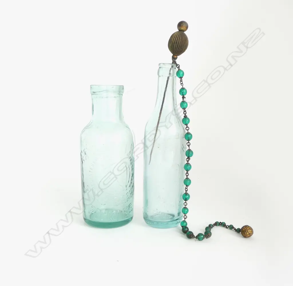 TWO ANTIQUE BOTTLES AND A HAIR SKEWER Image 1++