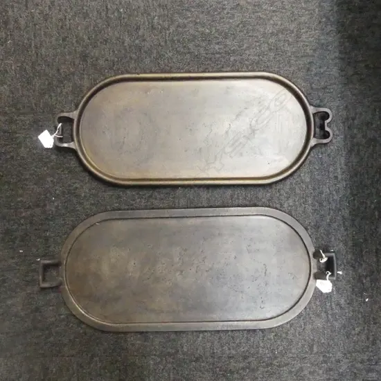 1125/1985  2 VINTAGE CAST IRON GRIDDLES L580MM