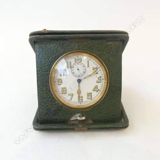 LEATHER CASED SWISS TRAVEL CLOCK; In working condition