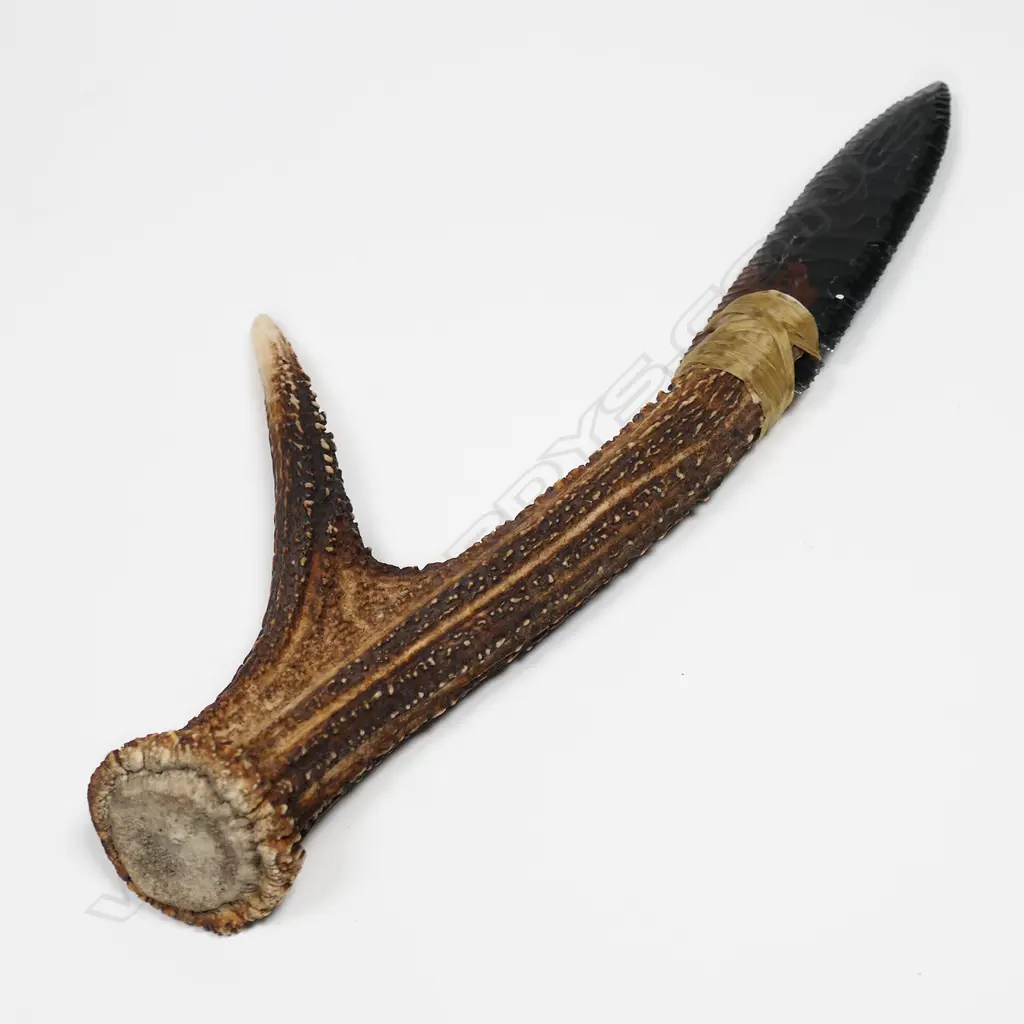 A striated glass pressure-flaked spear-point knife blade Image 1++