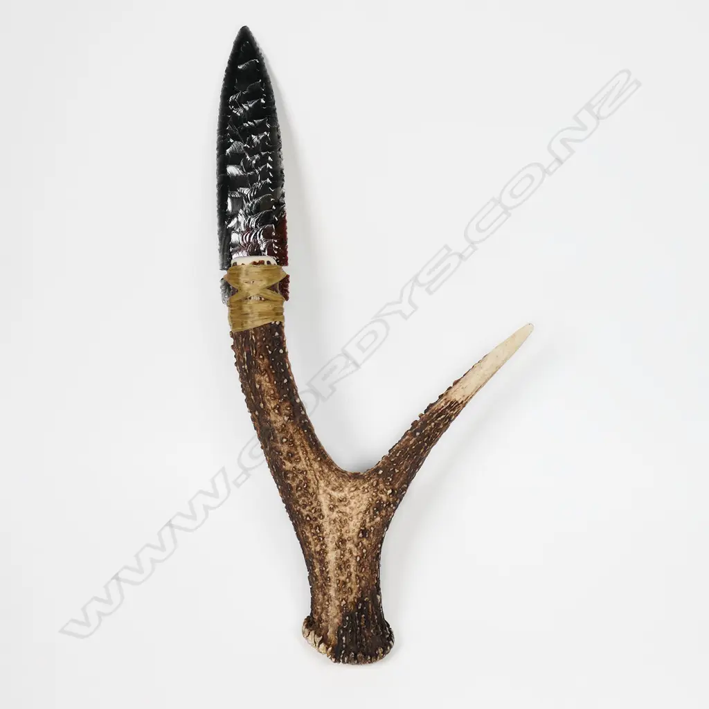 A striated glass pressure-flaked spear-point knife blade Image 1++
