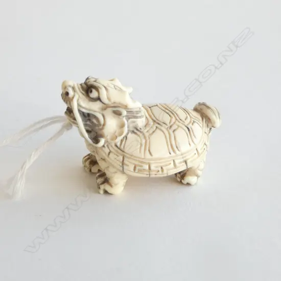 IVORY NETSUKE BIXI, SIGNED