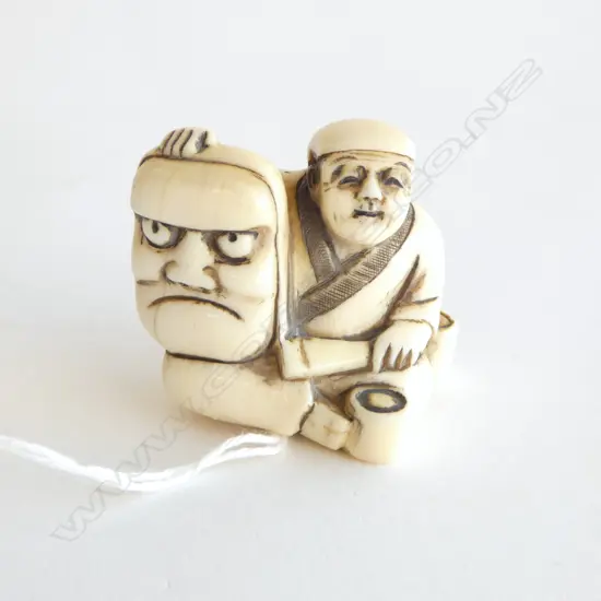 IVORY NETSUKE MASK MAKER, SIGNED