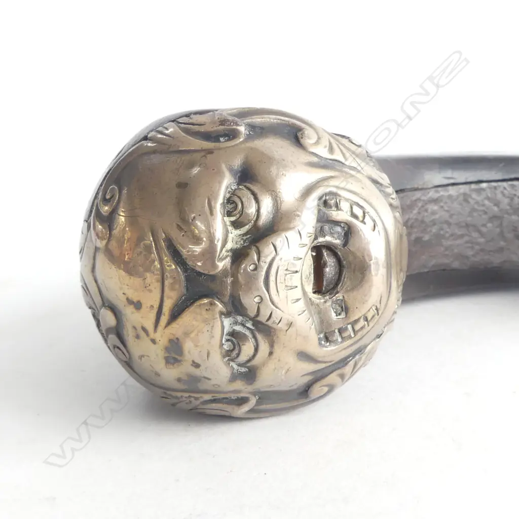19thC STEEL CANON BARRELLED FLINTLOCKPISTOL some pitting. Mask form silver cap to the walnut butt scroll inlay L.280mm.  Image 1++