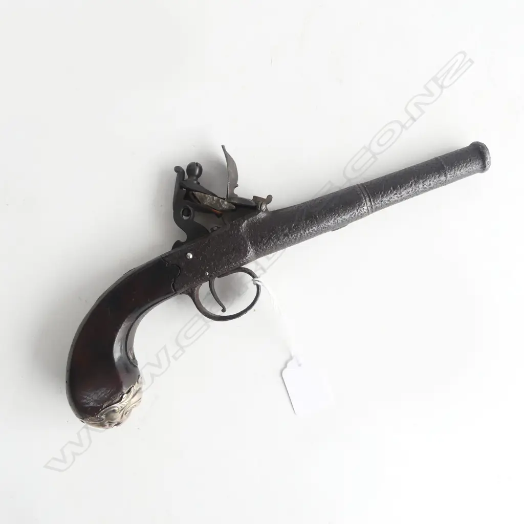 19thC STEEL CANON BARRELLED FLINTLOCKPISTOL some pitting. Mask form silver cap to the walnut butt scroll inlay L.280mm.  Image 1++