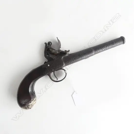 19thC STEEL CANON BARRELLED FLINTLOCKPISTOL some pitting. Mask form silver cap to the walnut butt scroll inlay L.280mm. 