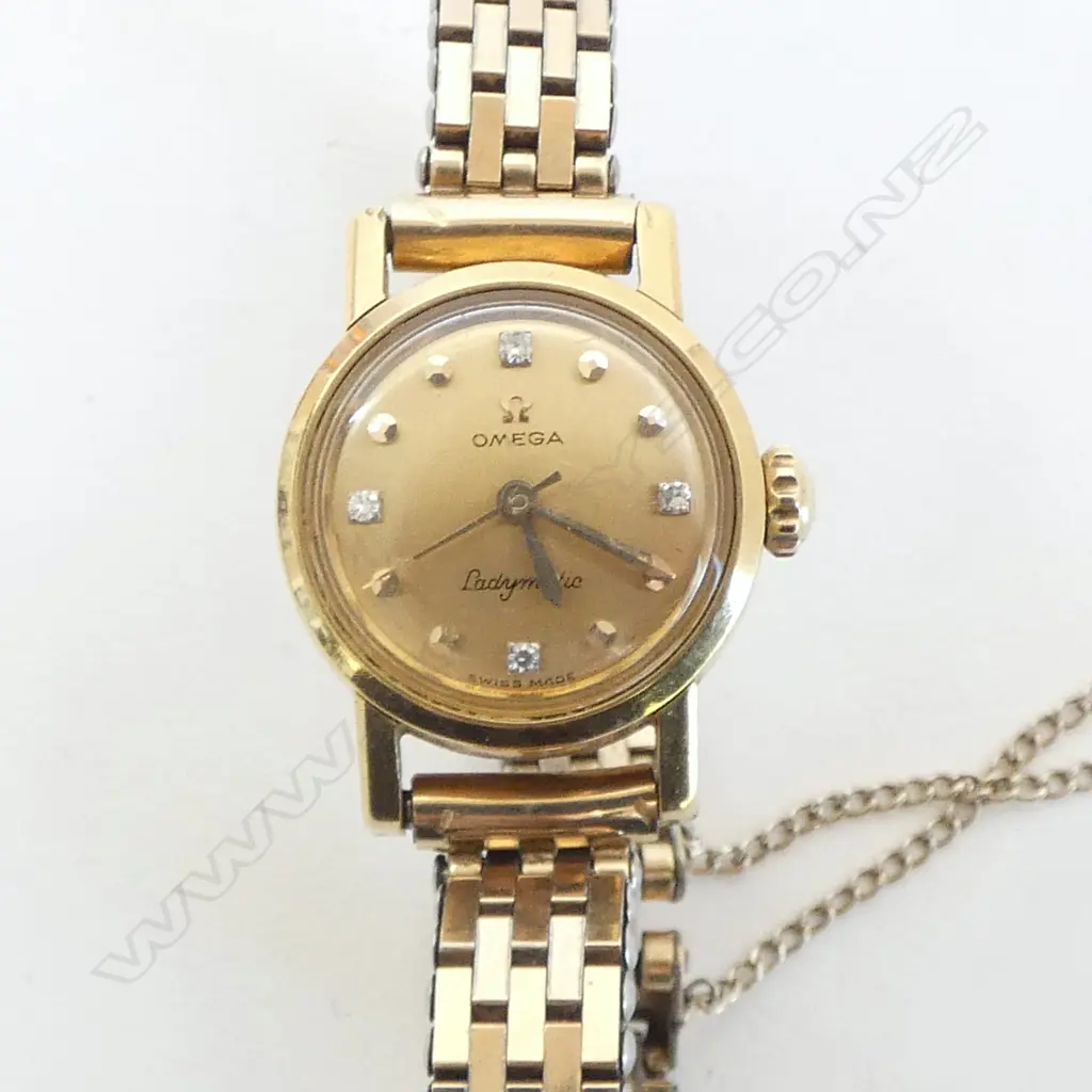 VINTAGE 18CT GOLD CASED & 4 DIAMOND OMEGA 'LADYMATIC' WRIST WATCH. Gold plate strap. Running. 30gms total Image 1++