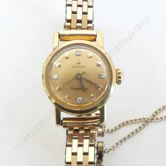 VINTAGE 18CT GOLD CASED & 4 DIAMOND OMEGA 'LADYMATIC' WRIST WATCH. Gold plate strap. Running. 30gms total