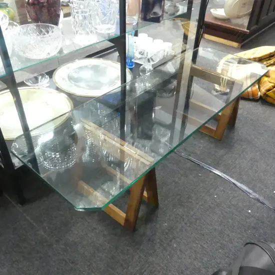 GLASS TOP COFFEE TABLE (CHIPS) ON 2 WOODEN BASES