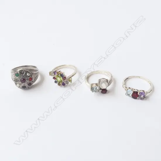FOUR SILVER & COLOURED STONE RINGS