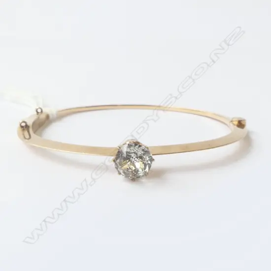 14CT GOLD HINGED BANGLE WITH WHITE STONE CLAW SET 8.74gm