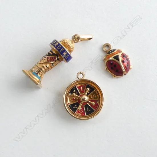 3 18CT ENAMELLED CHARMS; lighthouse roulette wheel ladybug  3.68gms