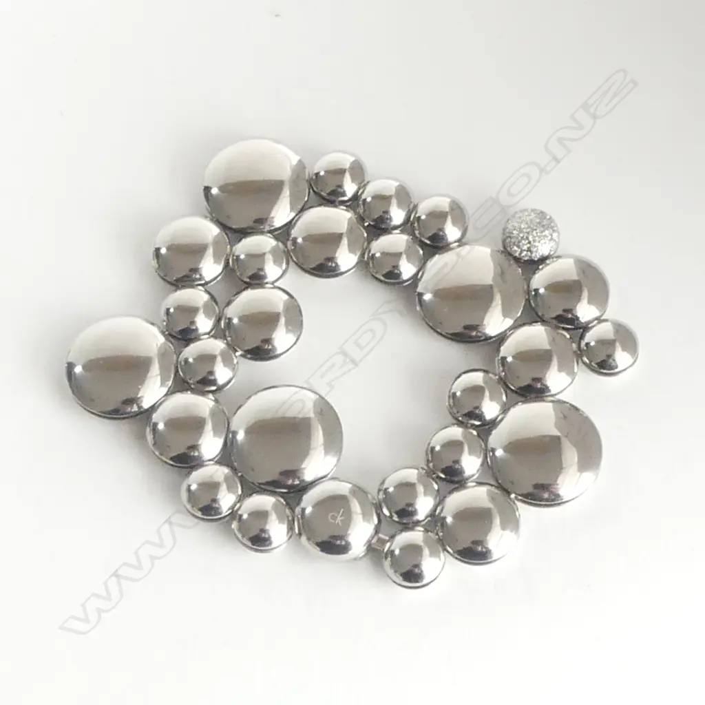 **RTV**  CALVIN KLEIN 31 DIAMOND (0.155CT) 'LIQUID' BRACELET. White metal. 58.6grmS L.16.5CM SMALL SIZE Image 1++