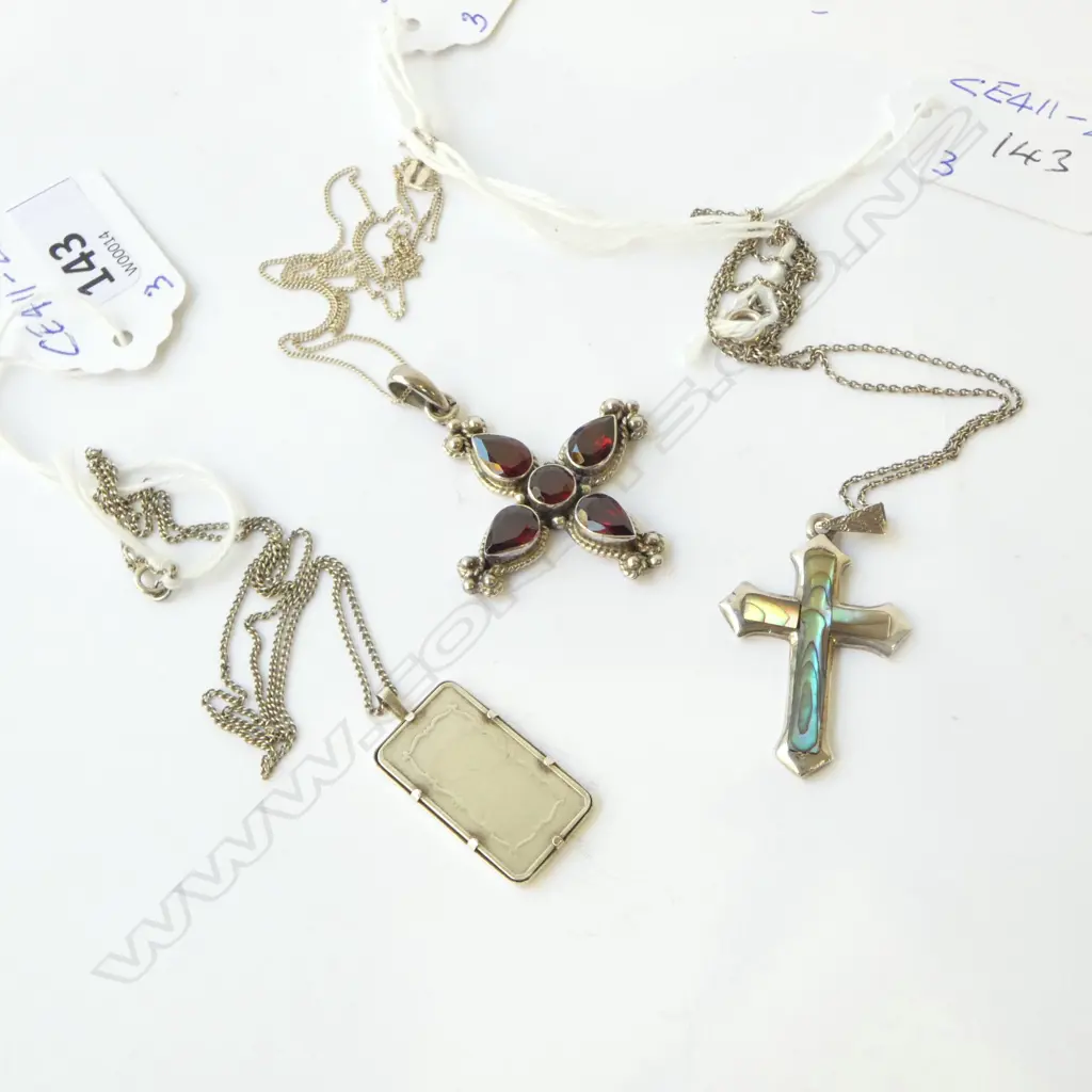 3 SILVER PENDANTS; PAUA/SILVER CROSS, GARNET CROSS on silver chain & NZ MINT SILVER BAR w CERAMCO on silver chain Image 1++