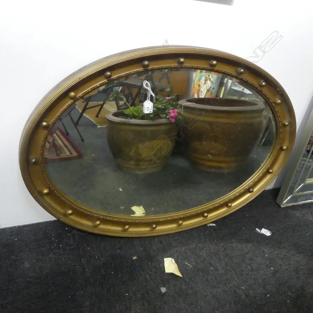 EARLY 20THC GILTWOOD OVAL MIRROR W ball detail to frame. Bevelled edge 950 x 645mm Image 1++