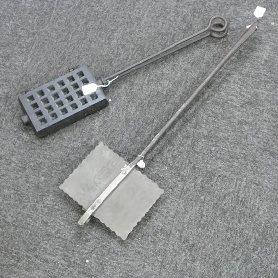 3714/2673  2 LONG HANDLED CAST IRON WAFFLE IRONS L680MM