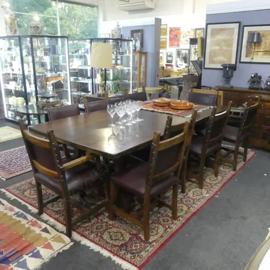 DINING TABLE w. STRETCHER BASE & 10 CHAIRS (2 ARE CARVERS)