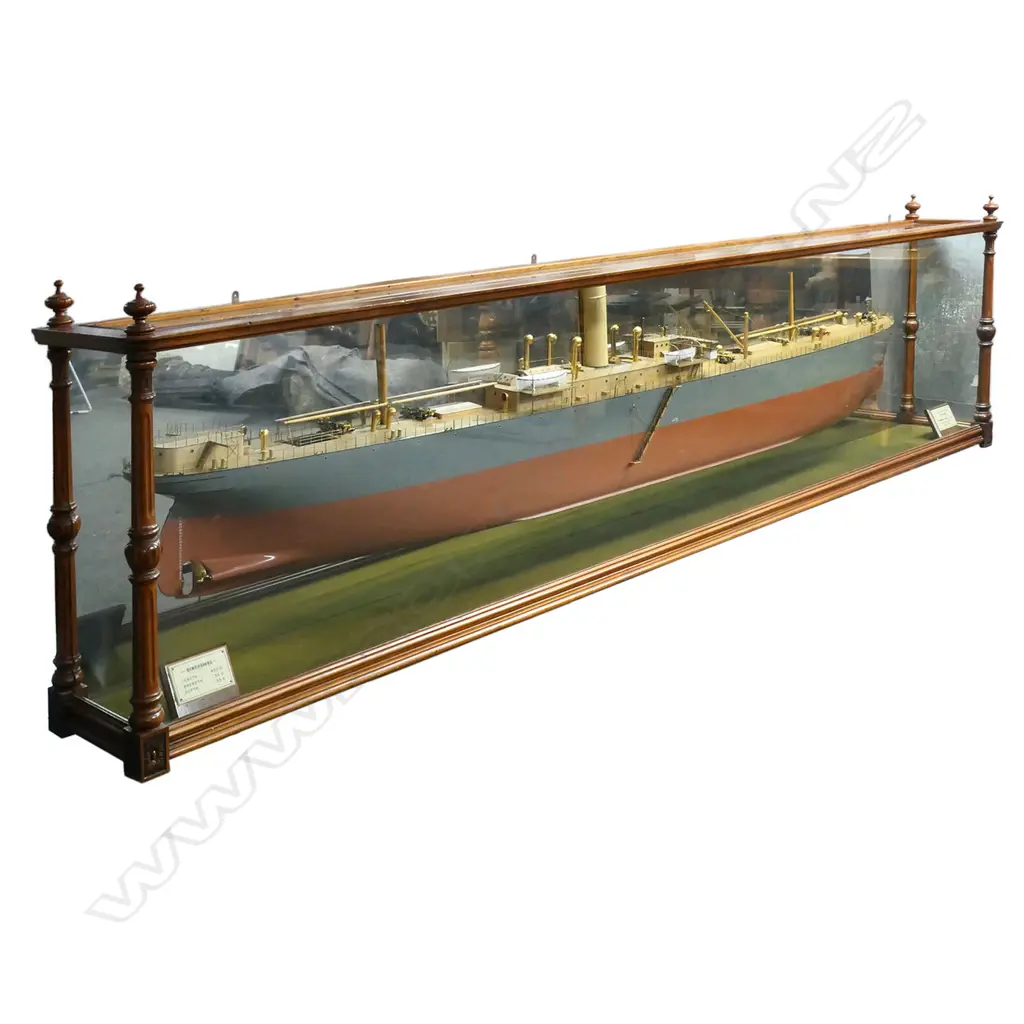 An exceptional quality professionally built ship builders model of the 'Twin Screw Steamer 'NIWARU'' -  by Workman, Clark & Co. Ltd. Belfast. The fine detail including brass fittings, rigging, life boats etc. In glazed walnut case with turned detail and mirrored back. Image 1++