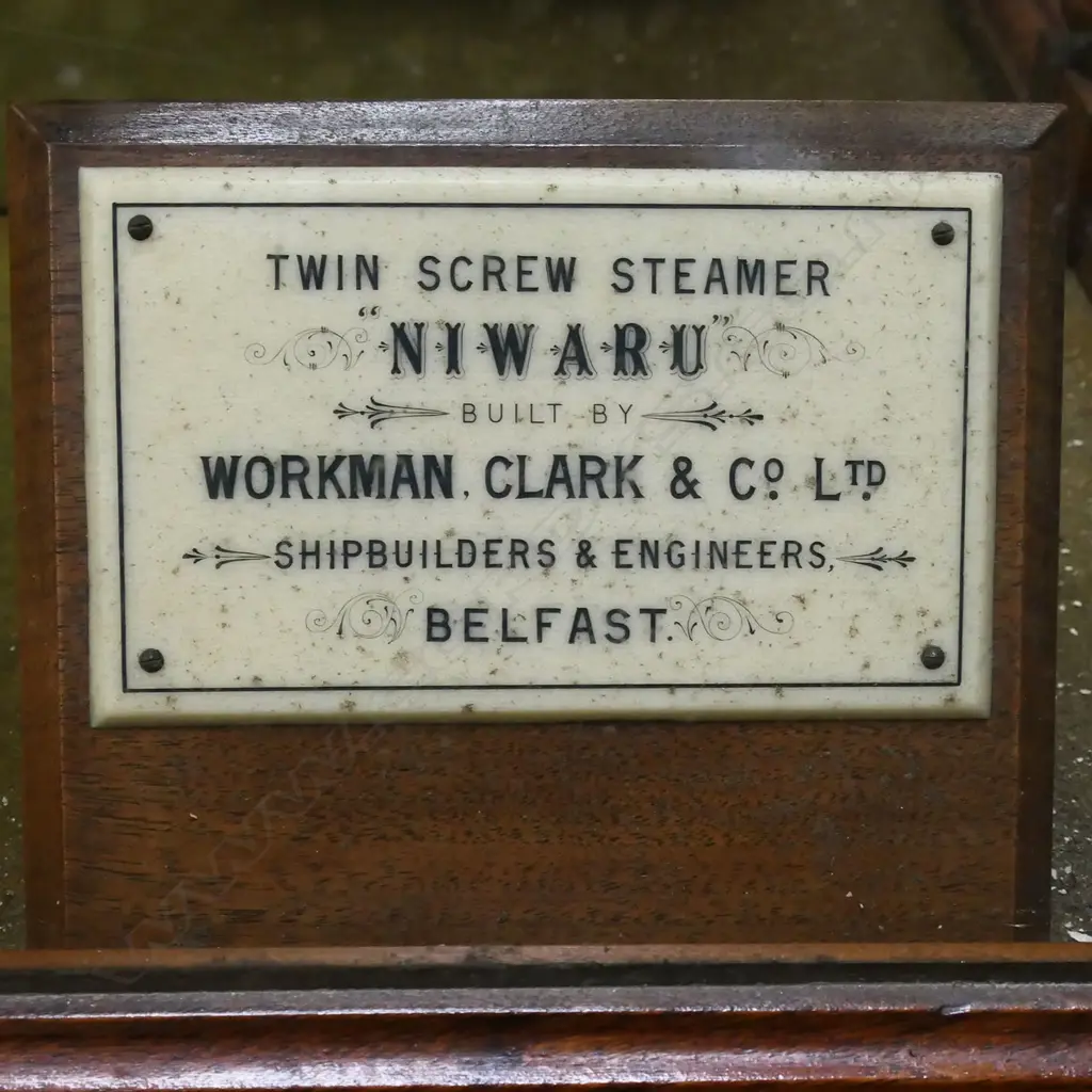 An exceptional quality professionally built ship builders model of the 'Twin Screw Steamer 'NIWARU'' -  by Workman, Clark & Co. Ltd. Belfast. The fine detail including brass fittings, rigging, life boats etc. In glazed walnut case with turned detail and mirrored back. Image 1++