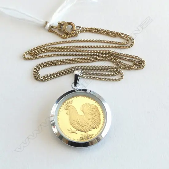 ORIENTAL 9999 GOLD? TOKEN ON SILVER GILT CHAIN, 4.2grms total