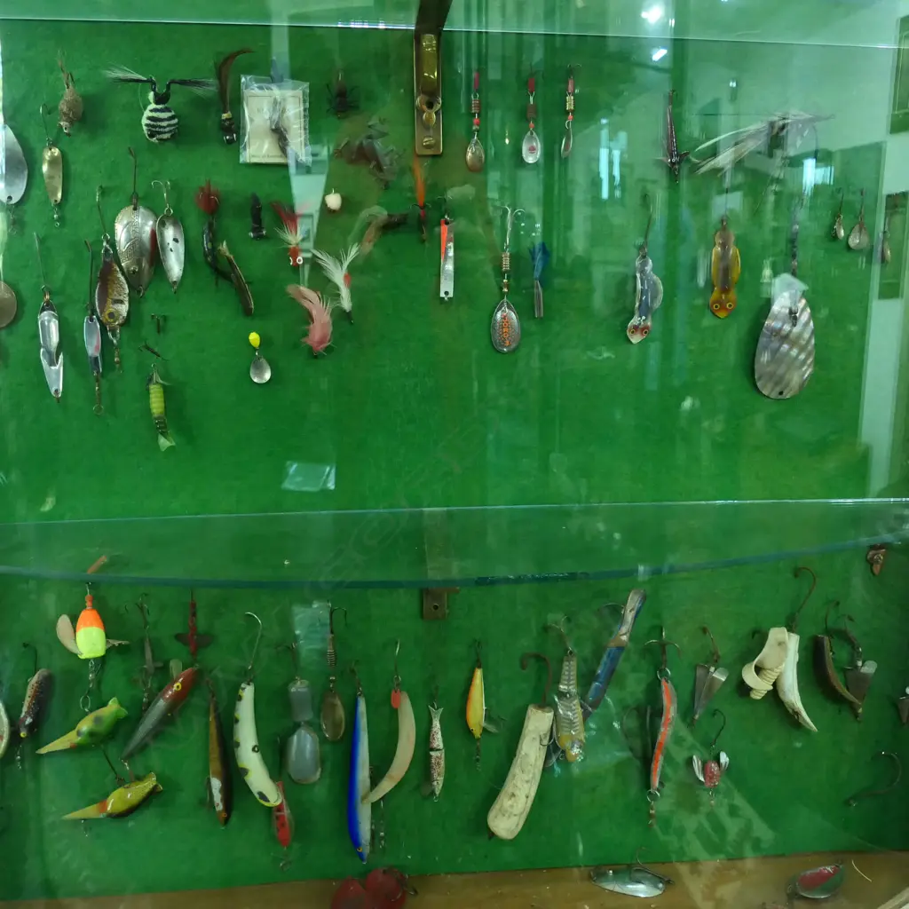 VICT CONVEX GLASS WALL DISPLAY CABINET H1200 L800MM CONTAINING VINTAGE COLLECTION OF FRESH WATER FISHING LURES APROX 140 Image 1++