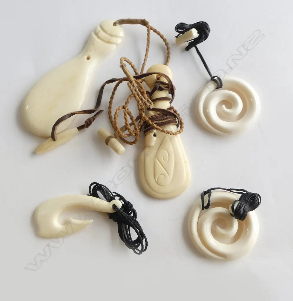 ASSORTED CARVED BONE PENDANTS Image 1++