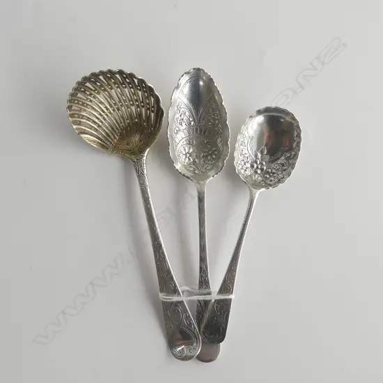 BOTTOM MARKED DOUBLE STRUCK STG SILVER SUGAR SIFTER (MARKS WORN) + 2 GEO. SILVER SHEFFIELD BERRY SPOONS; TOTAL 105gms