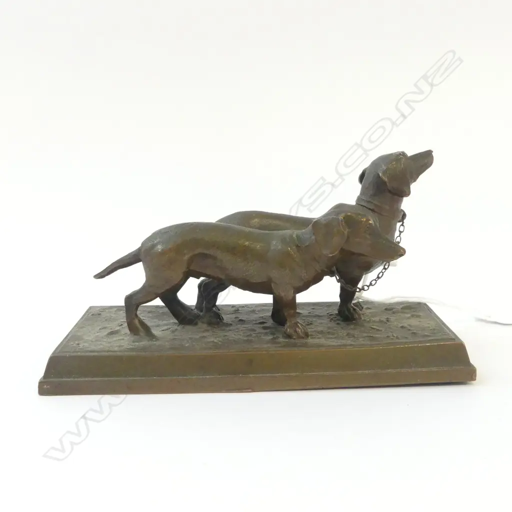 BRONZED WHITE METAL SCULPTURE OF TWO DASHOUNDS on rectangular base. L.155mm Image 1++