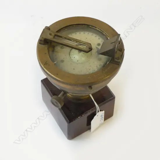 VINTAGE BRASS NAVAL ISSUE 'MEDIUM LANDING COMPASS' with broad arrow mark. Dia.100mm. Raised on mahogany stand H.130mm 