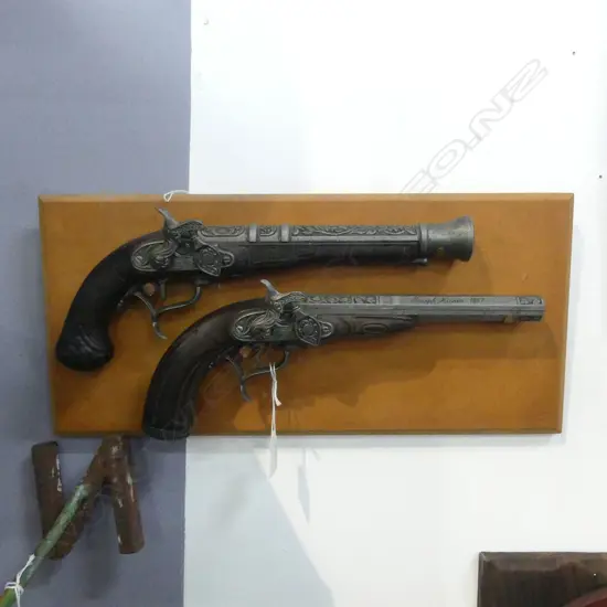 2 ANTIQUE STYLE MODEL PISTOLS, MOUNTED ON BOARD 215x455mm