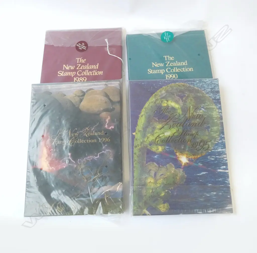 4 UNWRAPPED CASED 'THE NZ STAMP COLLECTION' ALBUM, YEARS; 1989,'90,'95,'96 Image 1++
