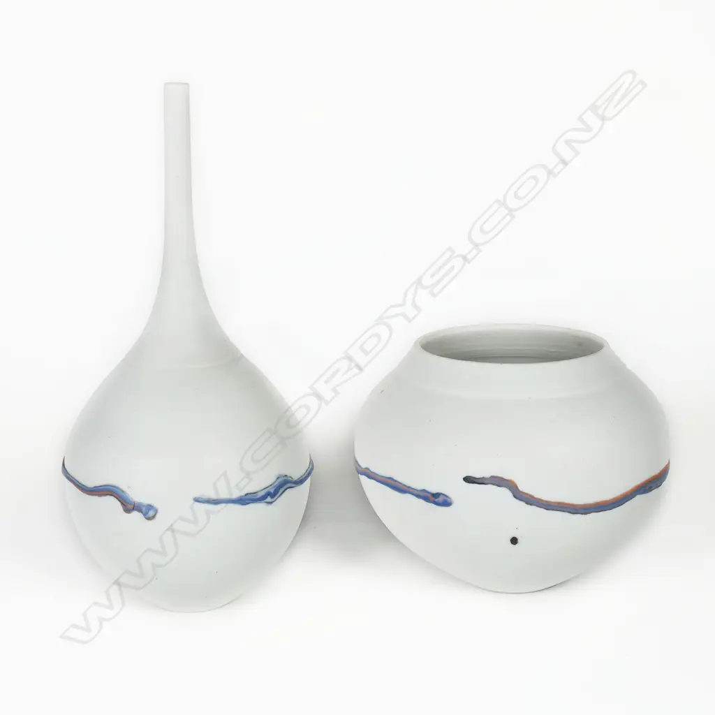 Potter unknown twosmall porcelain vases; grey/white matte finish with thick blue/black glaze dripped across the body. H.70/140mm Image 1++