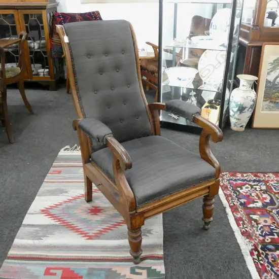 ANTIQUE UPHOLSTERED LIBRARY CHAIR