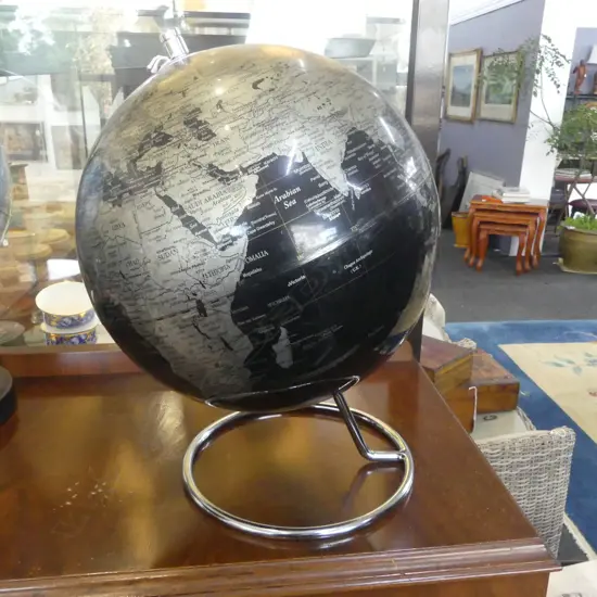 REVOLVING WORLD GLOBE ON CHROME STAND 